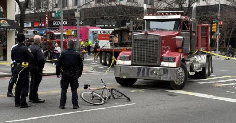 Early morning on 2nd Avenue, a cyclist goes down